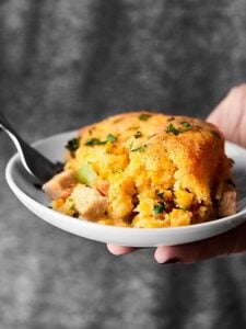 #ad This Leftover Turkey Cornbread Casserole is the PERFECT way to revive Thanksgiving leftovers. Turkey and veggies topped with gravy and an easy cornbread! showmetheyummy.com #SwitchCircle #JennieO