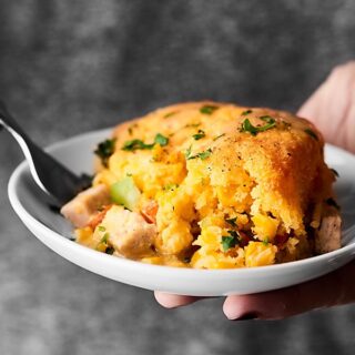 #ad This Leftover Turkey Cornbread Casserole is the PERFECT way to revive Thanksgiving leftovers. Turkey and veggies topped with gravy and an easy cornbread! showmetheyummy.com #SwitchCircle #JennieO