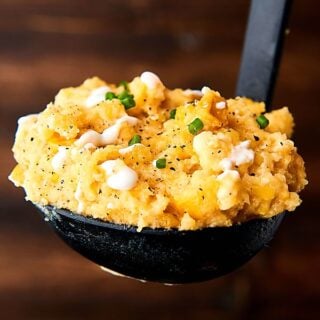 This Slow Cooker Corn Pudding is SO easy to make and is loaded with corn, cornbread mix, sour cream, cream cheese, cheddar cheese, and more! Perfect for the holidays! showmetheyummy.com