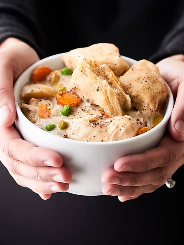 This Crockpot Chicken and Dumplings Recipe is winter comfort food perfection! Super quick and easy to make and SO hearty and cozy! showmetheyummy.com #crockpot #chicken