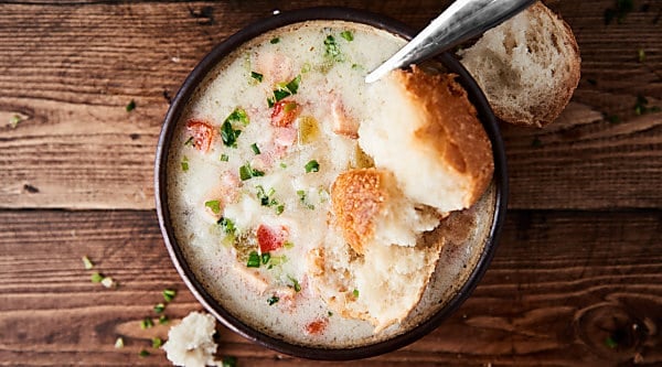 This Crockpot Potato Soup is SO quick and easy to make and is loaded with leftover ham, bacon, and frozen hash browns! Gluten free and no cream of "x" soup! showmetheyummy.com #crockpot #potatosoup
