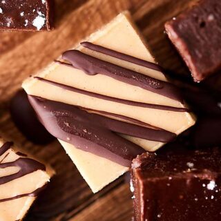 This Easy Peanut Butter Fudge Recipe is made in the microwave! Make the white chocolate version or the double chocolate version! Both are gluten free and made without sweetened condensed milk. showmetheyummy.com #fudge #chocolate