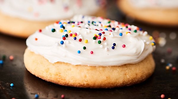 These really are Grandma's Best Sugar Cookies! They're perfectly soft, a little bit chewy, with the right amount of tang from the sour cream. Don't forget the buttercream frosting! showmetheyummy.com #sugarcookies #cookies