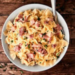 #ad This One Pot Ham and Cheese Pasta Recipe is the perfect way to use up that leftover holiday ham! A quick and easy recipe full of pasta, swiss cheese, and ham! showmetheyummy.com Made in partnership w/ @smithfieldfoods #HolidayHub