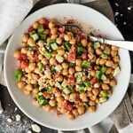 This Chopped Chickpea Greek Salad Recipe is the perfect vegetarian, gluten free light lunch or side dish! Full of chickpeas, chopped veggies, and smothered in a tangy greek yogurt and herb dressing! showmetheyummy.com #vegetarian #salad