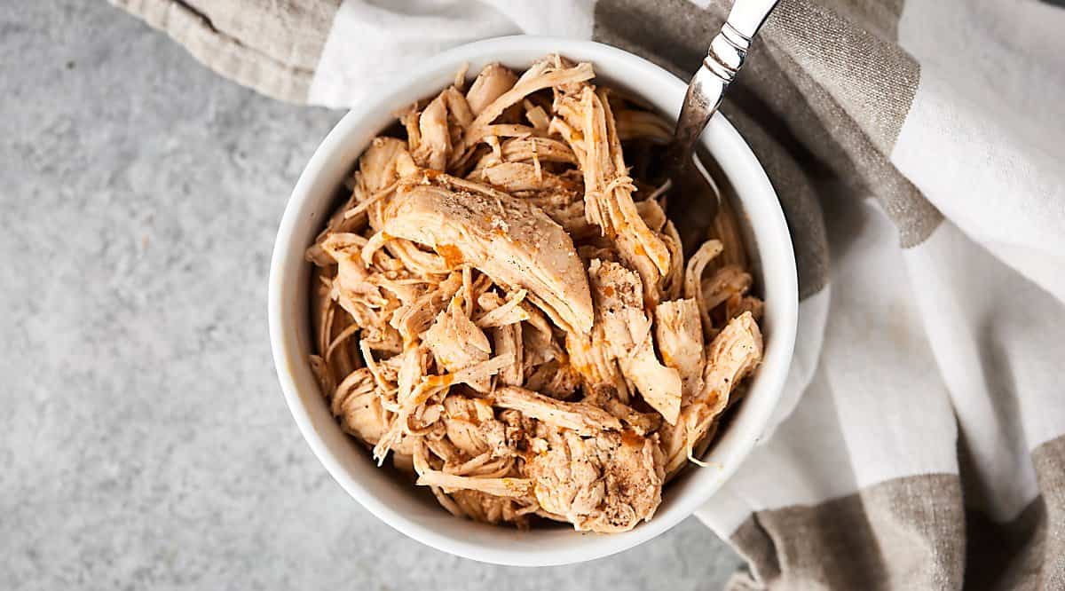 Bowl of instant pot shredded chicken above