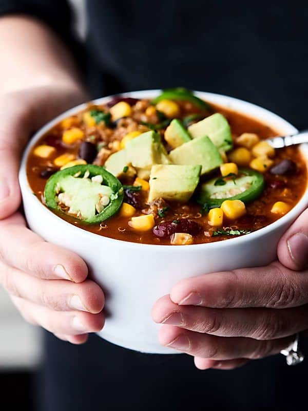 This Instant Pot Vegetarian Chili is SO quick and easy to make and full of vegetables, beans, and quinoa! Healthy. Gluten free. Vegan. Ready in 30 mins! Less than 300 calories per serving. showmetheyummy.com #instantpot #vegan #healthy