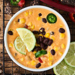 #ad This Loaded Queso Recipe is full of cheese, tomatoes, black beans, corn, chiles, taco seasonings, and more! Easy. Cheesy. Gluten Free. Delicious! showmetheyummy.com Made in partnership w/ @redgoldtomatoes #queso #cheesedip