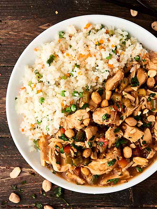 Kung pao chicken and rice on plate above