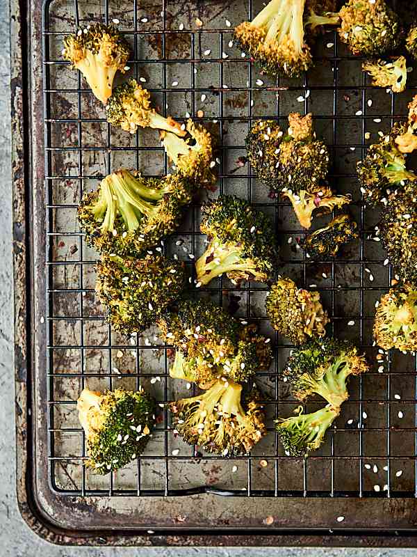 Asian roasted broccoli on baking sheet above