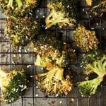 Roasted broccoli turned up a notch, this Asian Roasted Broccoli Recipe is healthy and full of coconut oil, soy sauce, spices, and just a touch of sriracha! Vegan. Can be gluten free. showmetheyummy.com #broccoli #vegan #glutenfree