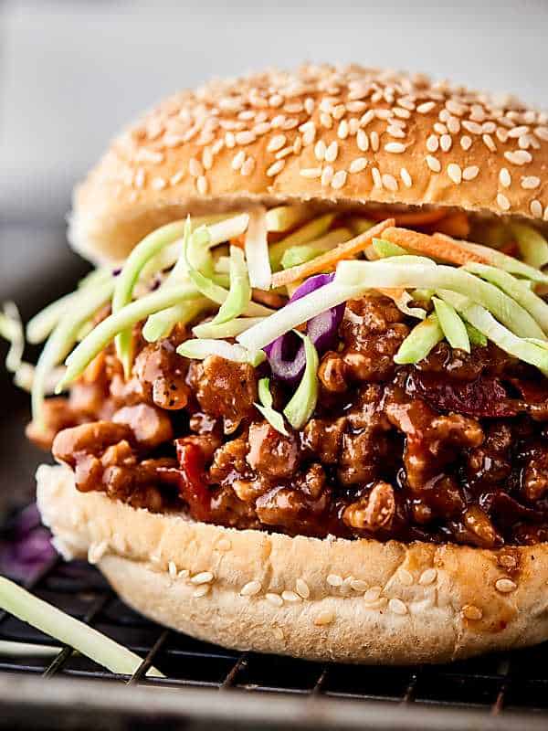 An Asian twist on a classic, these Asian Sloppy Joes are seriously SO delicious. Full of ground pork, hoisin sauce, ginger, chili garlic sauce, and more! You’ll never guess this flavor packed recipe is SO easy! showmetheyummy.com #sloppyjoes #asian