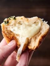 #ad Easy Artichoke Dip Stuffed Rolls. Refrigerated biscuits stuffed with an artichoke and jalapeno dip, monterey jack cheese and smothered in butter. YUM. showmetheyummy.com Made in partnership w/ @laterrafina