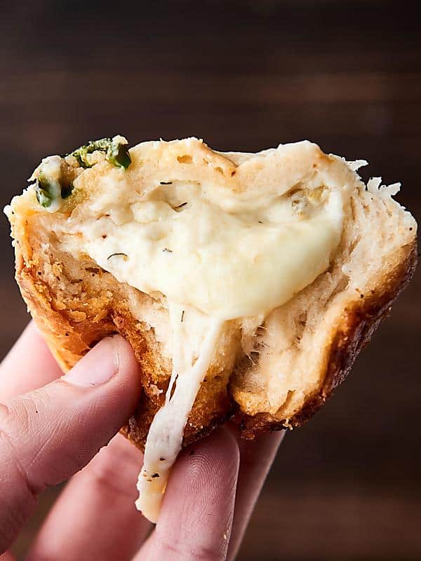 #ad Easy Artichoke Dip Stuffed Rolls. Refrigerated biscuits stuffed with an artichoke and jalapeno dip, monterey jack cheese and smothered in butter. YUM. showmetheyummy.com Made in partnership w/ @laterrafina