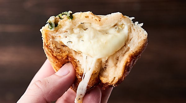 #ad Easy Artichoke Dip Stuffed Rolls. Refrigerated biscuits stuffed with an artichoke and jalapeno dip, monterey jack cheese and smothered in butter. YUM. showmetheyummy.com Made in partnership w/ @laterrafina