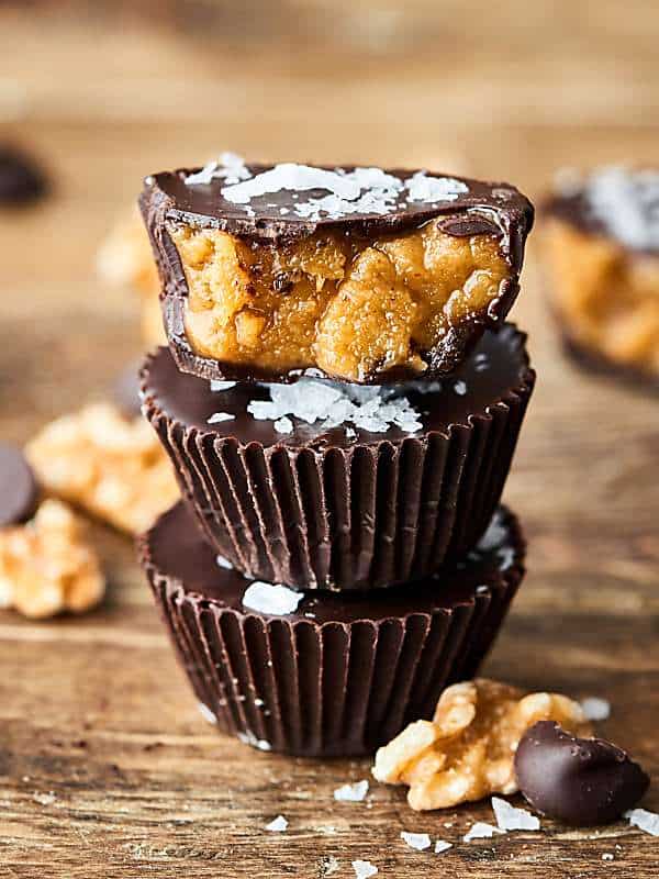 #ad A healthier take on a peanut butter cup, these homemade dark chocolate walnut butter cups are quick, easy, delicious, and full of toasted walnuts, extra virgin olive oil, a touch of maple syrup, and sea salt! showmetheyummy.com Made in partnership w/ @CAWalnuts #healthy #chocolate