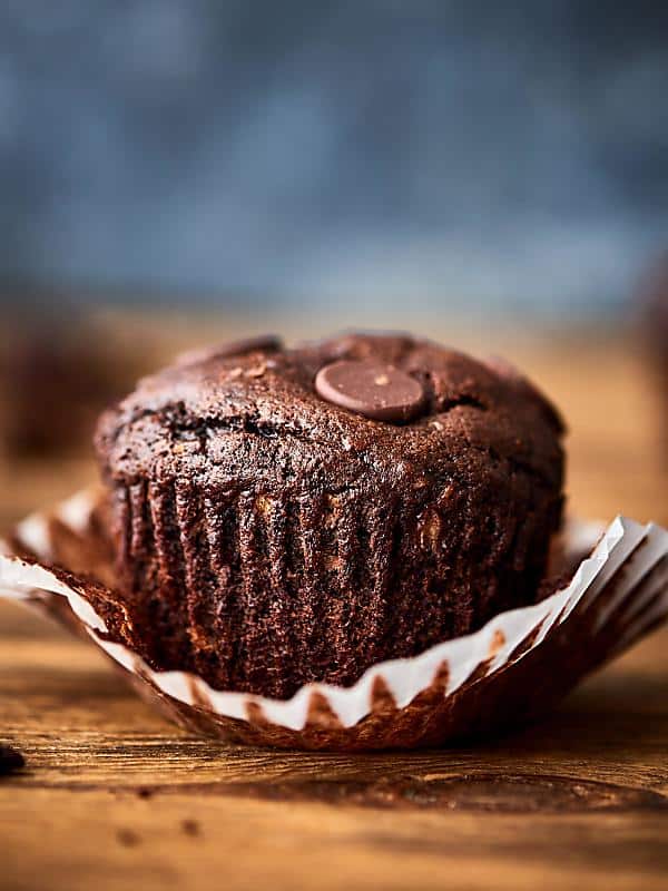 Double chocolate banana muffin unwrapped side view