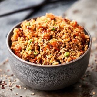 This ground turkey fried rice is a healthier twist on a take out classic! Leftover brown rice is mixed with a few veggies, extra lean ground turkey, spices, soy sauce, rice vinegar, hoisin, chili garlic sauce, and more! showmetheyummy.com #healthy #friedrice