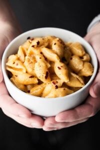 This Instant Pot Mac and Cheese Recipe only requires a few minutes and a few ingredients: pasta shells, broth, salt, pepper, milk, parmesan, gruyere, and sharp cheddar cheese to make! showmetheyummy.com #instantpot #macandcheese