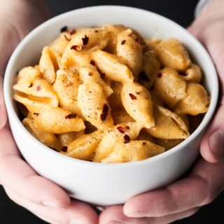 This Instant Pot Mac and Cheese Recipe only requires a few minutes and a few ingredients: pasta shells, broth, salt, pepper, milk, parmesan, gruyere, and sharp cheddar cheese to make! showmetheyummy.com #instantpot #macandcheese
