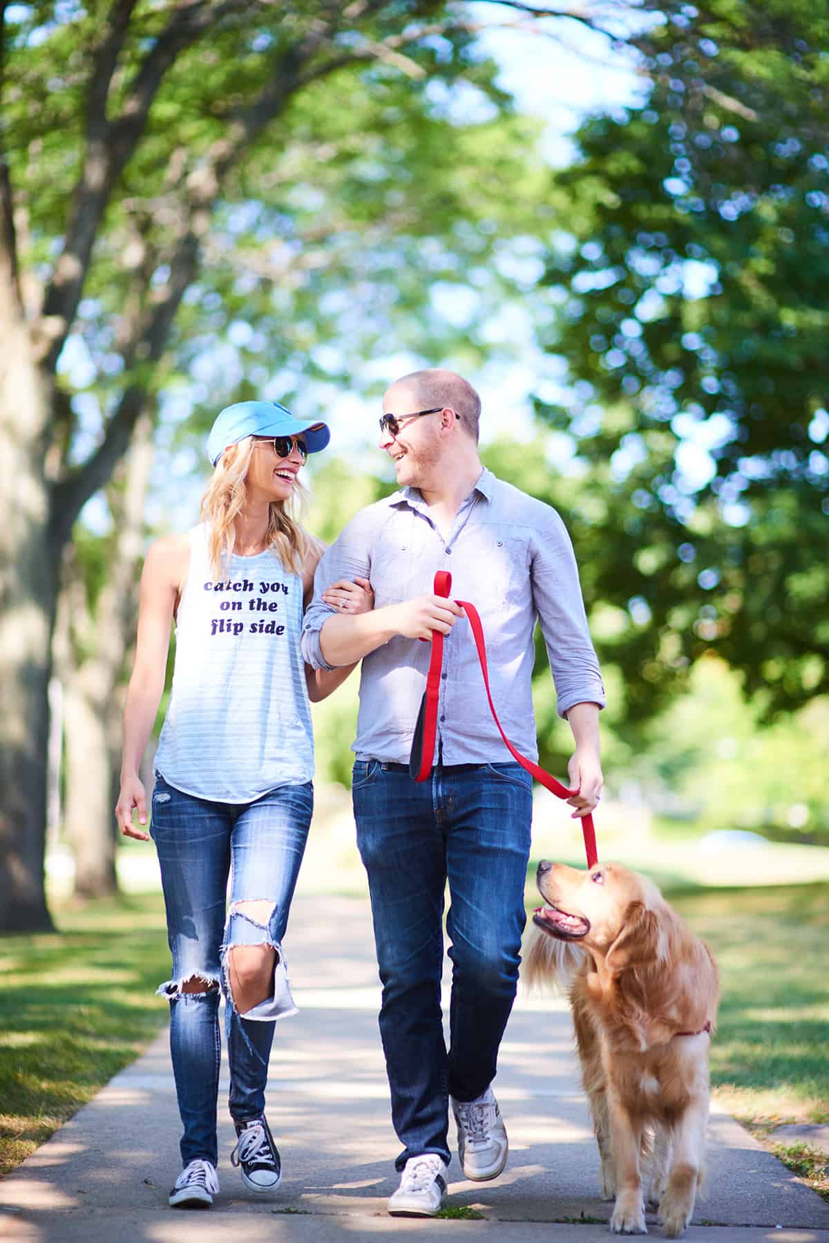 picture of man and woman walking dog