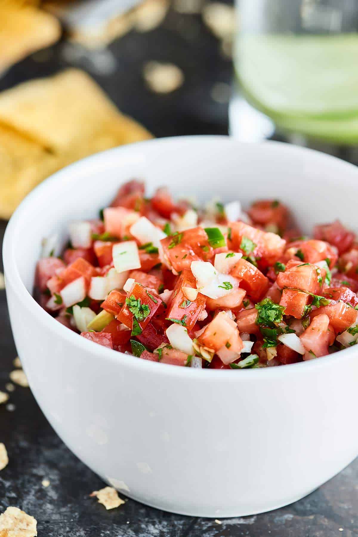 This Easy Pico de Gallo Recipe comes together in a matter of minutes! Fresh tomatoes, onion, cilantro, jalapeno, lime, & garlic make this truly delicious. showmetheyummy.com #picodegallo #healthy #vegan