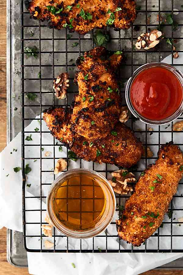#ad This Air Fryer Sweet and Spicy Walnut Chicken Tenders Recipe is a quick, easy, healthier twist on a fast food classic! Only seven ingredients necessary! showmetheyummy.com Made in partnership w/ @CAWalnuts #chickentenders #airfryer