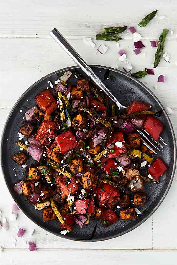 Balsamic roasted vegetables on plate above