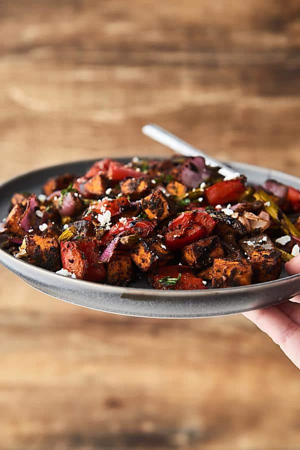 Roasted veggies on plate held