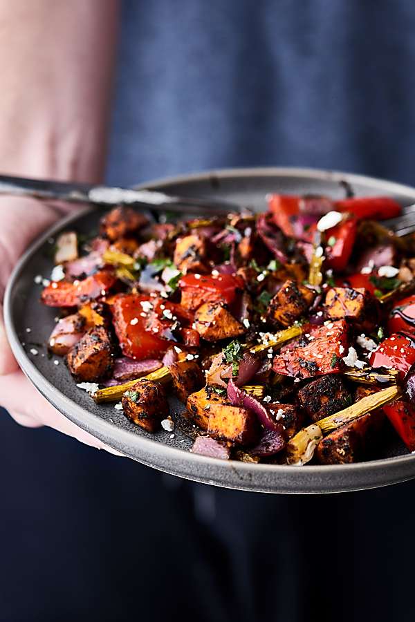 plate of balsamic roasted vegetables held