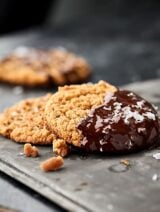 These Peanut Butter Cream Cheese Cookies only contain 8 ingredients: peanut butter, cream cheese, brown sugar, granulated sugar, vanilla, egg, baking soda, and salt! Ultra chewy, moist, and peanut butter-y! Perfect with a sprinkle of sea salt or melted dark chocolate. showmetheyummy.com #peanutbutter #cookies #glutenfree