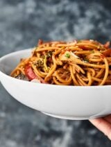 This Slow Cooker Lo Mein Recipe is quicker, easier, healthier, and dare I say . . . TASTIER than the traditional take out classic! Loaded with chicken, veggies, noodles, and the most delicious sauce, this healthy-ISH dinner comes together in minutes and will surely satisfy that Chinese take out craving! showmetheyummy.com #crockpot #lomein #healthy #dinner