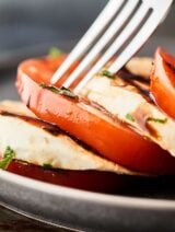 Mozzarella and tomato with fork closeup