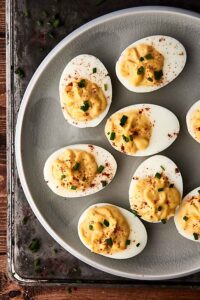 These Easy Deviled Eggs are a cinch to make thanks to my trick for making the best hard boiled eggs! They're also delicious and loaded with the creamiest filling of mayo, apple cider vinegar, dijon, horseradish, Worcestershire, relish, salt, paprika, and chives! showmetheyummy.com