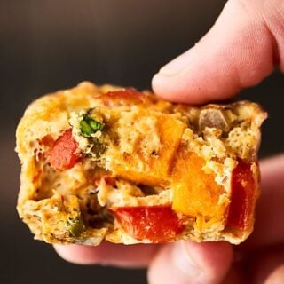 These Roasted Vegetable Breakfast Muffins make the perfect easy, healthy, make ahead breakfast! Whole eggs, egg whites, veggies: sweet potatoes, asparagus, bell pepper, onion -  and spices get baked into portable egg muffin cups! Gluten Free. Vegetarian! Less than 100 calories per muffin! showmetheyummy.com #healthy #eggmuffincups #roastedvegetables