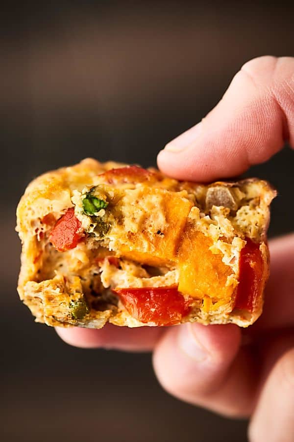 These Roasted Vegetable Breakfast Muffins make the perfect easy, healthy, make ahead breakfast! Whole eggs, egg whites, veggies: sweet potatoes, asparagus, bell pepper, onion -  and spices get baked into portable egg muffin cups! Gluten Free. Vegetarian! Less than 100 calories per muffin! showmetheyummy.com #healthy #eggmuffincups #roastedvegetables