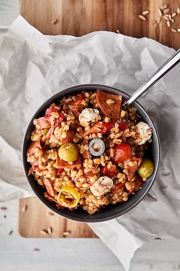 bowl of antipasto farro salad above