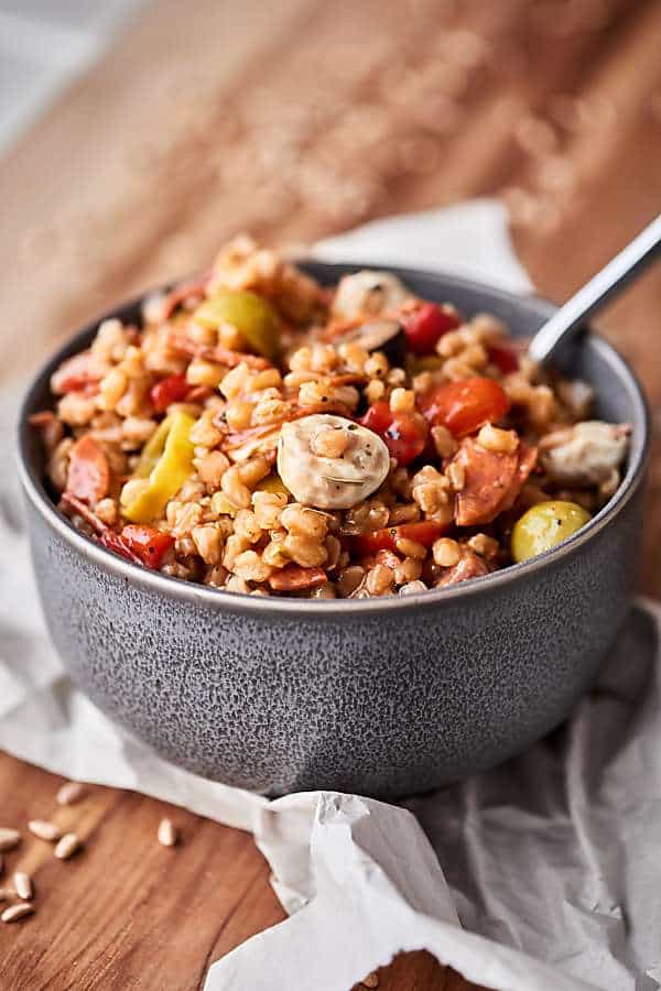 #ad This Antipasto Farro Salad is loaded with farro and all your favorite antipasto ingredients: roasted red pepper, tomatoes, onion, pepperoni, salami, mozzarella, pepperoncinis, olives, and more! Light yet SO satisfying. showmetheyummy.com Made in partnership w/ @bobsredmill #farro #antipasto #salad