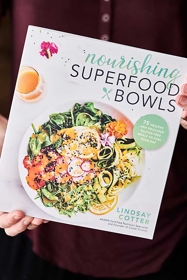 nourishing superfood bowls recipe book held