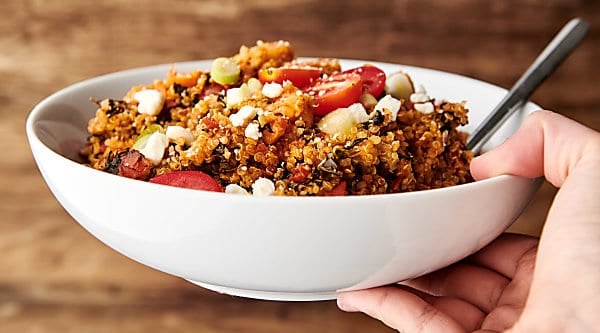 This Slow Cooker Spanish Shrimp and Quinoa Recipe is a flavorful and super healthy one pot wonder! Throw all the ingredients into your crockpot and let it cook! Ridiculously easy and full of quinoa, shrimp, spinach, tomatoes, and spices like smoked paprika, onion powder, and more! showmetheyummy.com #slowcooker #quinoa #shrimp