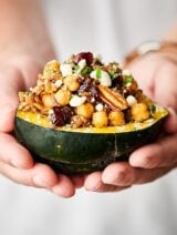 Instant Pot Stuffed Acorn Squash. Squash stuffed with veggies, wild rice, spices, herbs, chickpeas, cranberries, pecans, and more! Perfect for an easy meatless weeknight meal or as a vegetarian/vegan Thanksgiving side or main! Easy, healthy, can be vegan and gluten free! showmetheyummy.com #vegan #thanksgiving #instantpot #stuffedacornsquash #wildrice