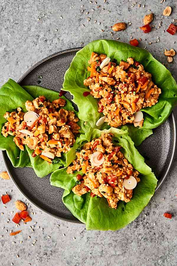 Three chicken lettuce wraps on plate above