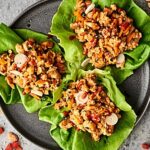 These Thai Peanut Chicken Lettuce Wraps are quick, easy, and healthy! Full of veggies: onion, carrot, and red pepper, ground chicken or turkey, and the most delicious homemade easy peanut sauce! showmetheyummy.com #peanutsauce #lettucewraps #thai #healthyrecipe