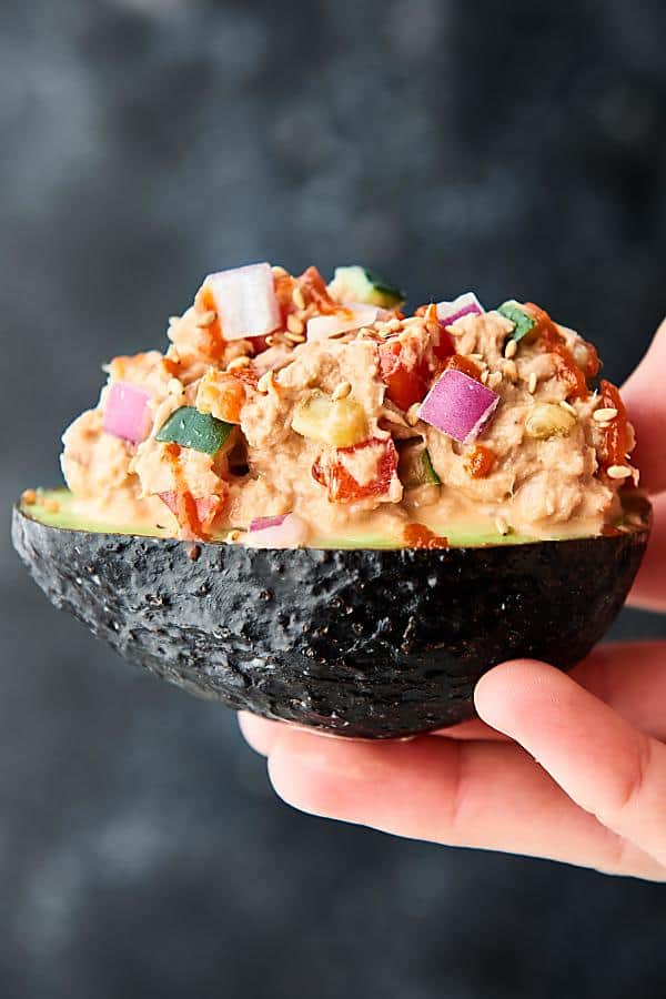 spicy tuna roll stuffed avocado held