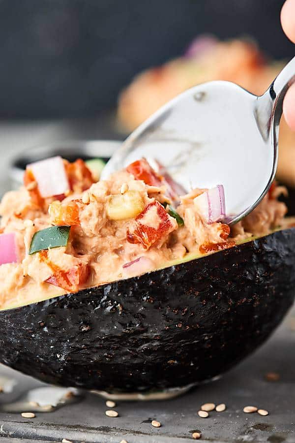 spoon in spicy tuna roll stuffed avocado