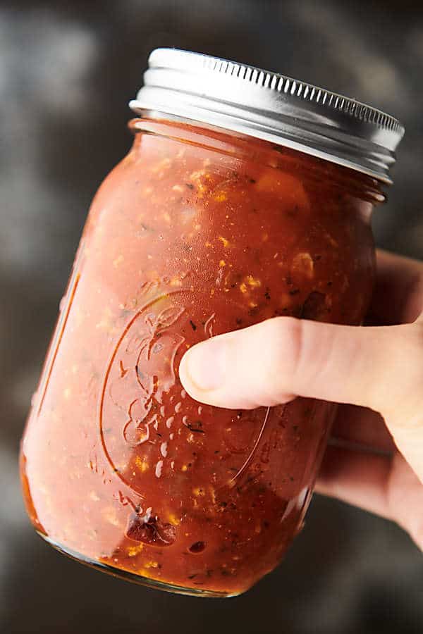 Mason jar of healthy turkey bolognese held