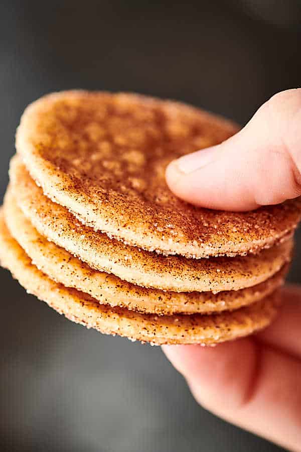Four cookies stacked and held