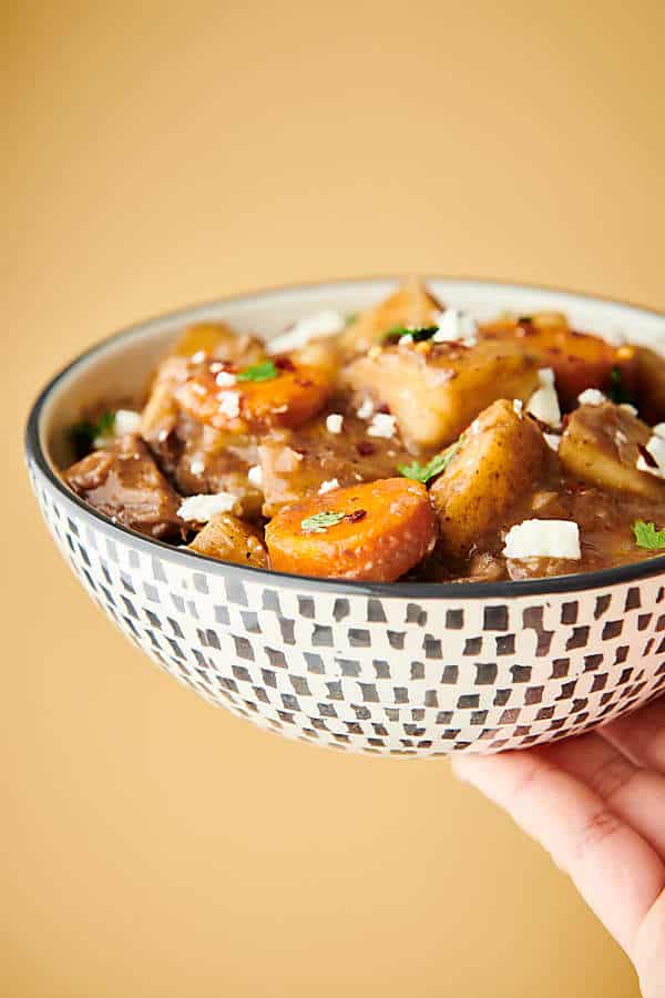 bowl of slow cooker beef stew held