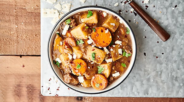 This Slow Cooker Beef Stew is SO easy to make. It's the perfect cozy, hearty fall meal! Loaded with chuck roast, veggies: onion, potatoes, carrots, and celery - beef broth, red wine (optional), and spices! A stick-to-your-ribs meal made healthier! showmetheyummy.com #slowcooker #crockpot #beefstew