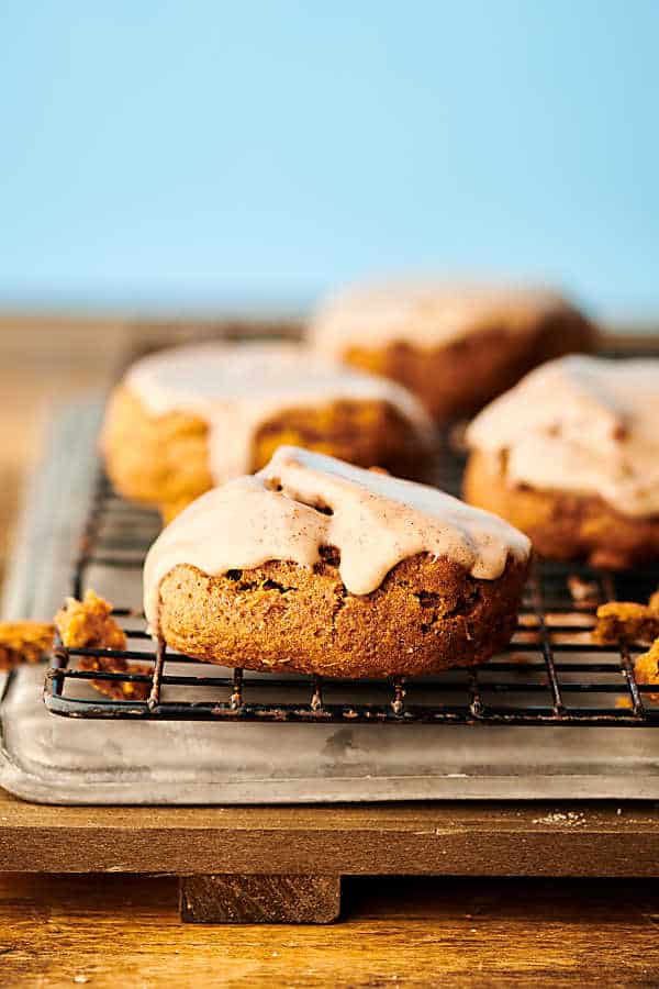 {New!} #ad Vegan Pumpkin Cookies with Maple Glaze. Hearty, slightly healthier pumpkin cookies made with whole wheat flour, spices, coconut oil, pumpkin, and maple syrup. Bonus: they get drizzled in the easiest vegan glaze! showmetheyummy.com Made in partnership w/ @bobsredmill #vegan #pumpkin #cookie